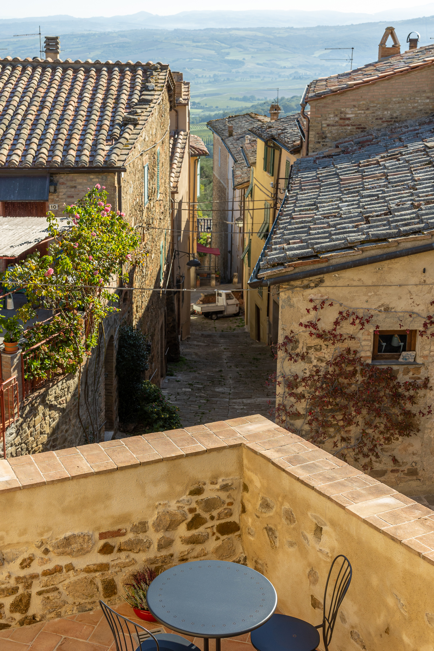 Montalcino village lane opening toward the Val d Orcia