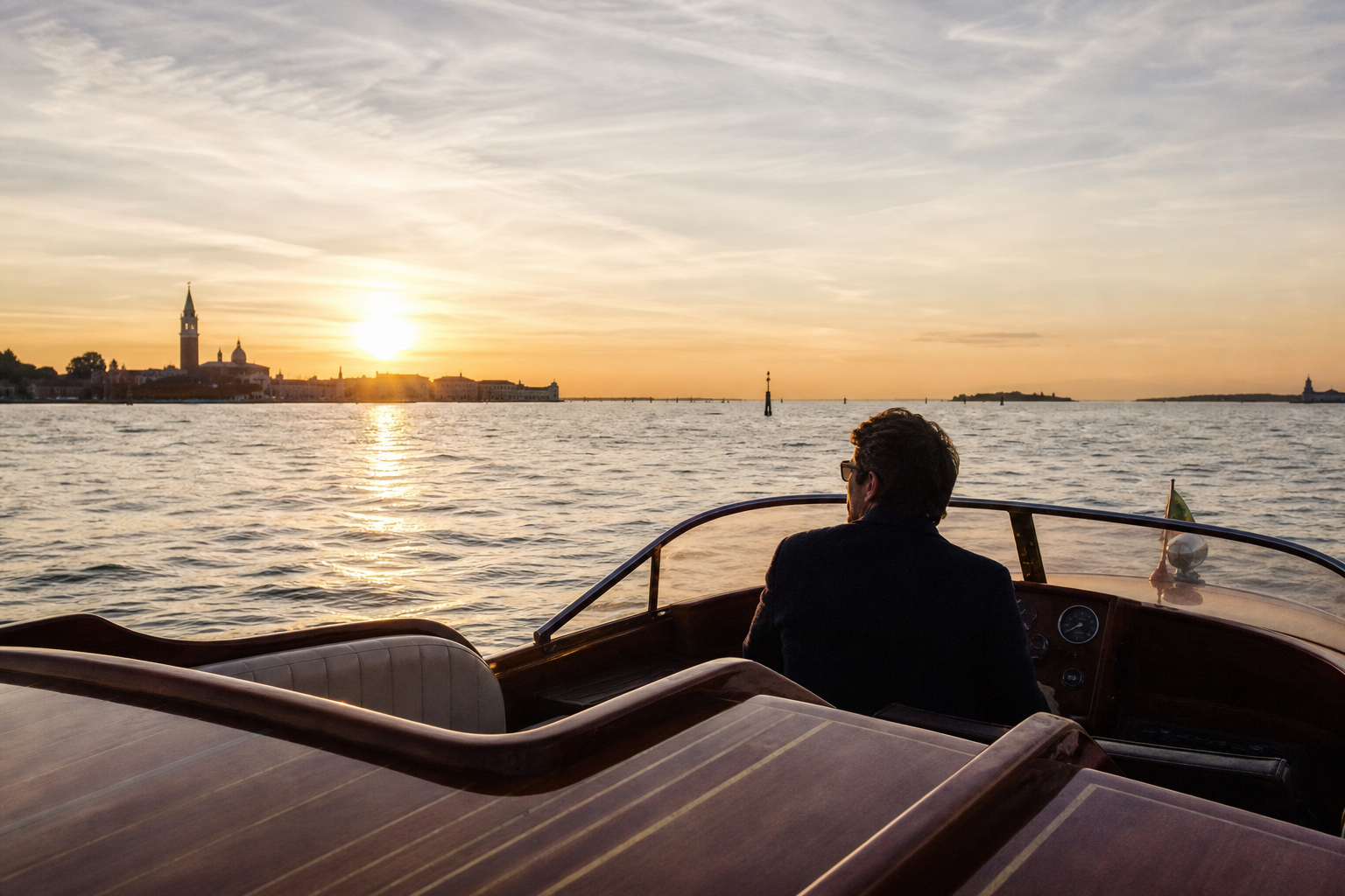 Private wooden boat crossing the Venice lagoon between Murano and Burano