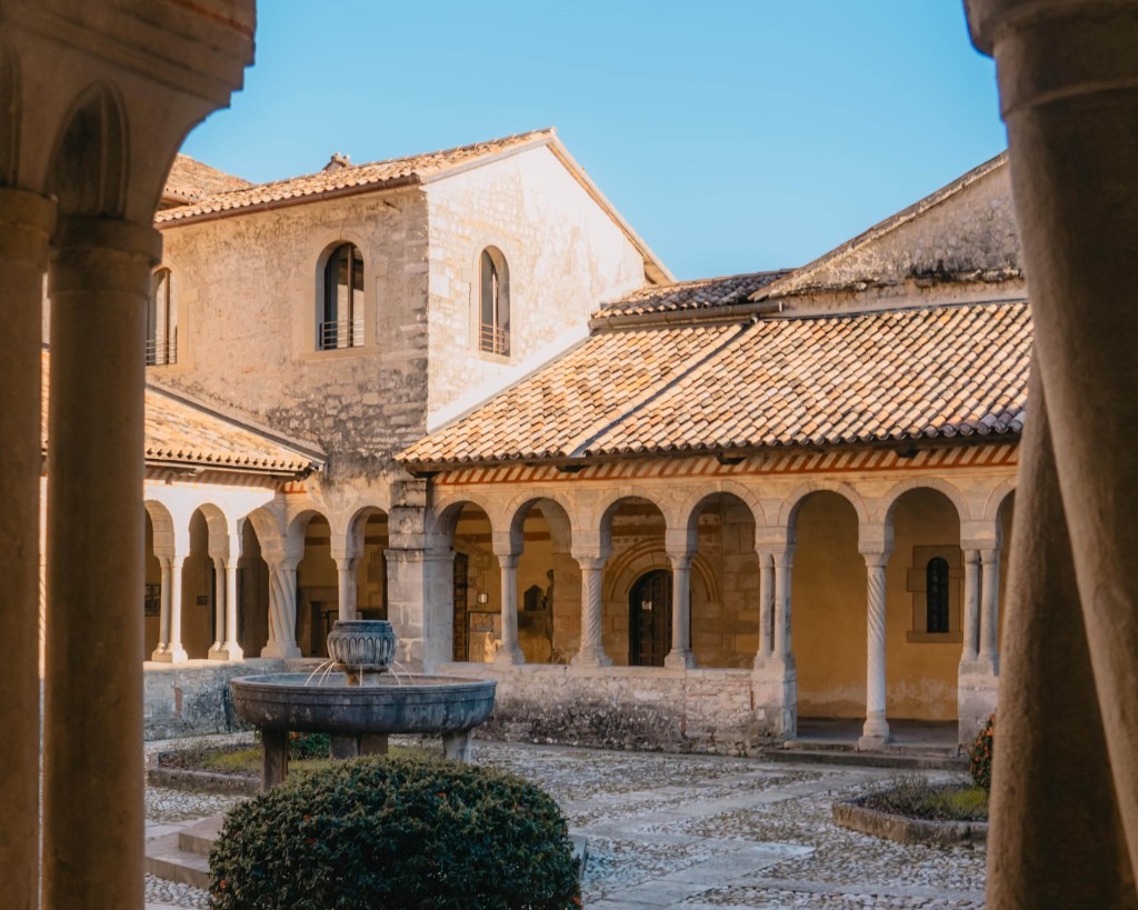 Follina Abbey cloister courtyard and stone fountain
