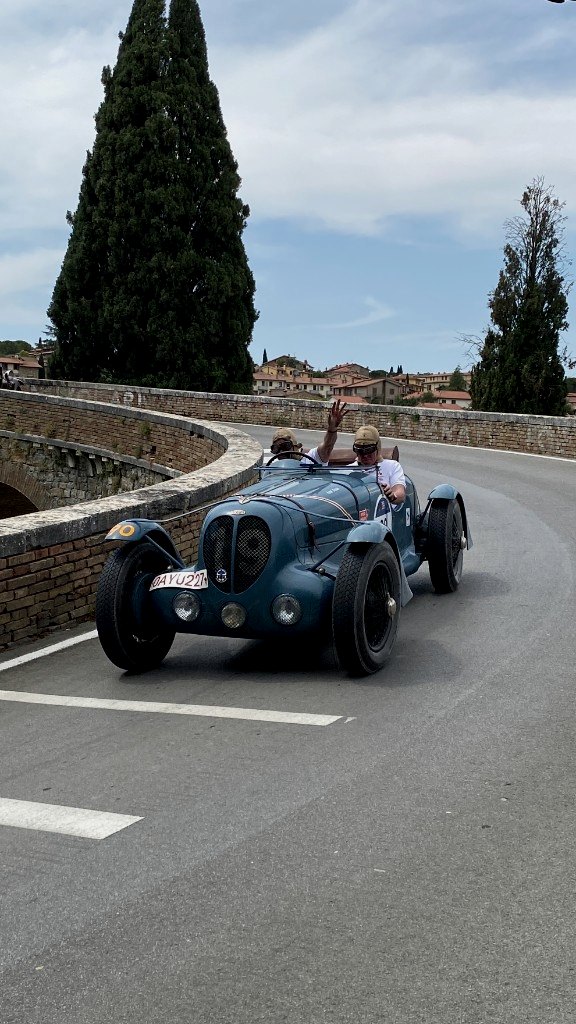 Ferrari tribute car on a hillside curve during the Mille Miglia - OHH! Italy