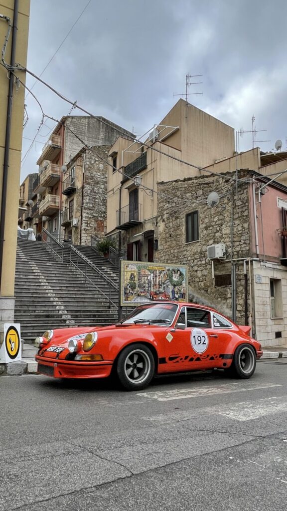 Porsche Carrera RS beneath a Targa Florio mural in a Sicilian mountain village - OHH! Italy Journal