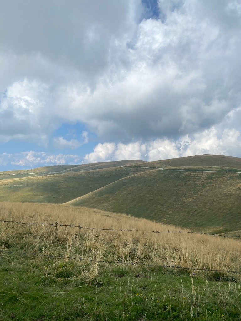 Open rolling hills and summer sky in Lessinia