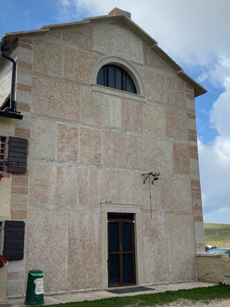 Traditional stone building in the high pastures of Lessinia