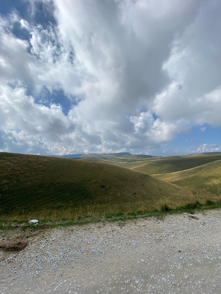Wide valley and cloud road across the Lessinia plateau