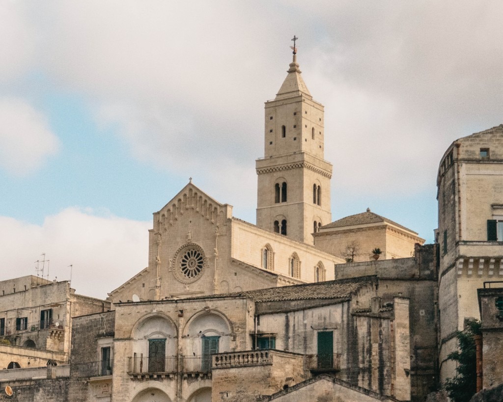 Close view of Matera cathedral among stone houses
