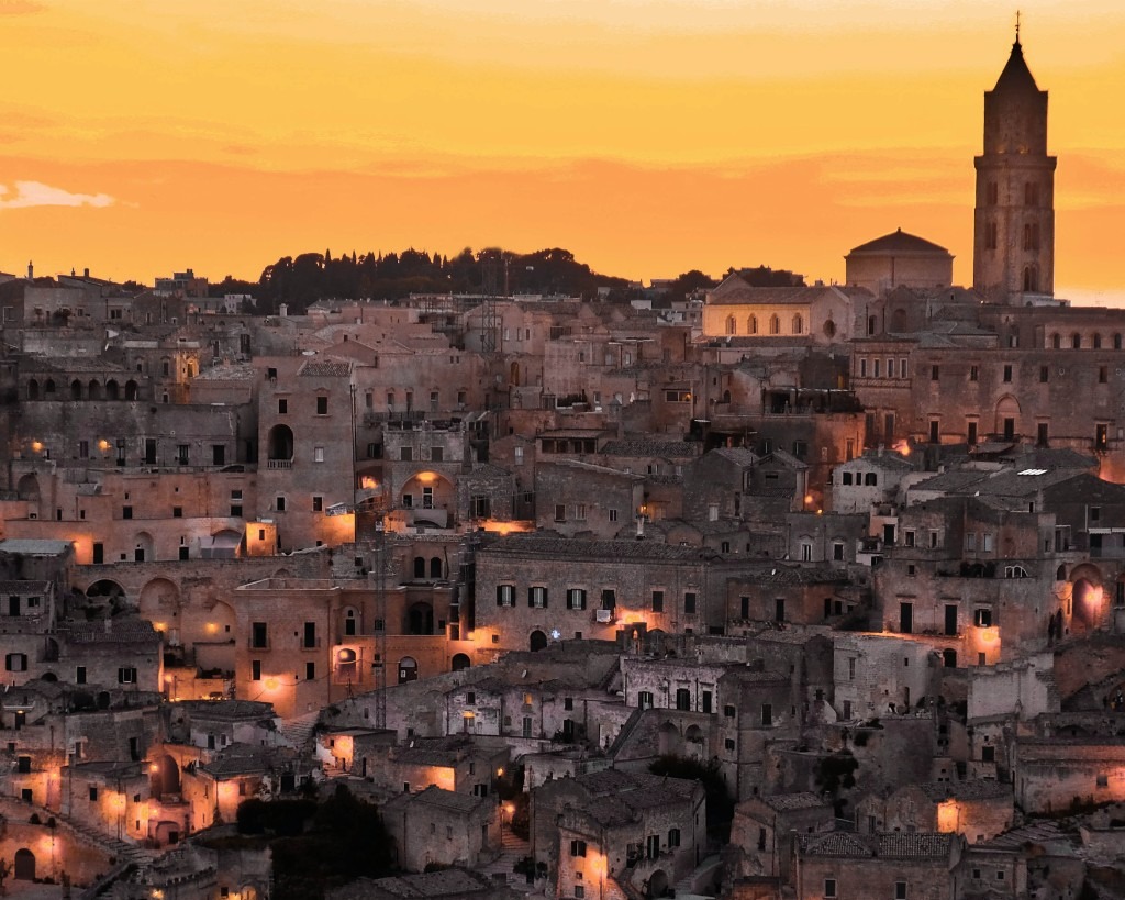 Matera Sassi at sunset with warm city lights