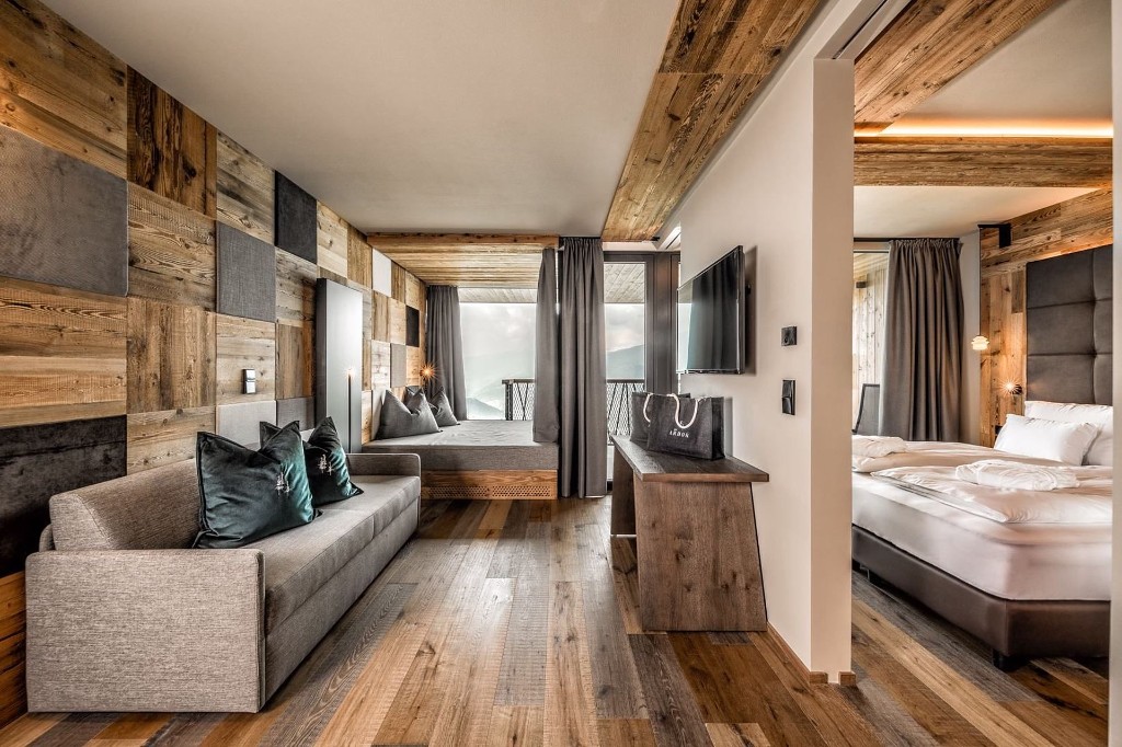 Hangout Suite · open living area, reclaimed timber and forest balcony