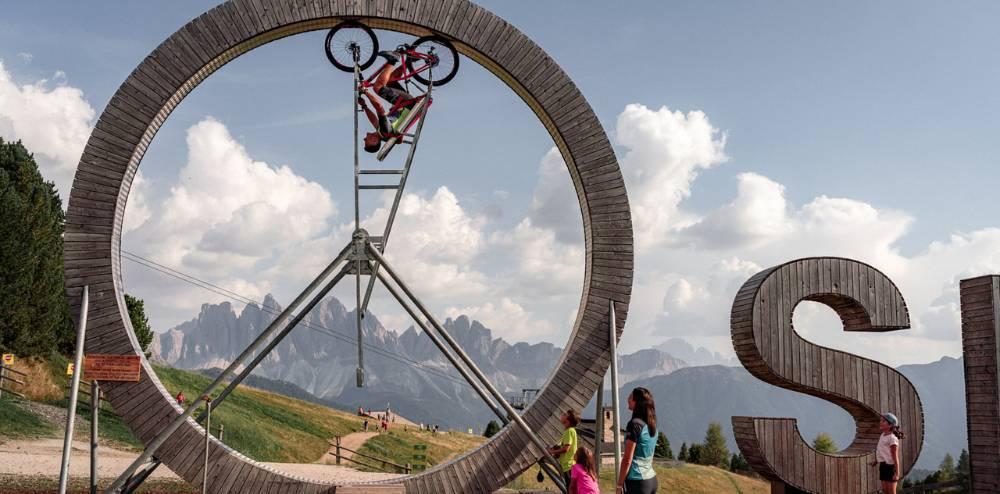 Plose Looping · cycling inside a suspended ring with Dolomites views