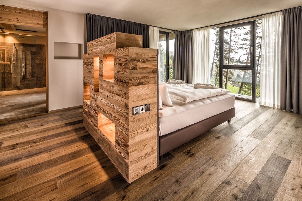 Treetop Suite bedroom · timber screen and forest views