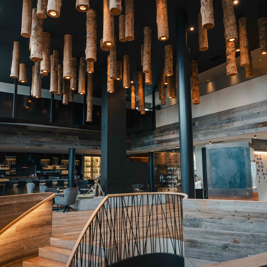 Main atrium staircase · suspended logs, lounge and bar
