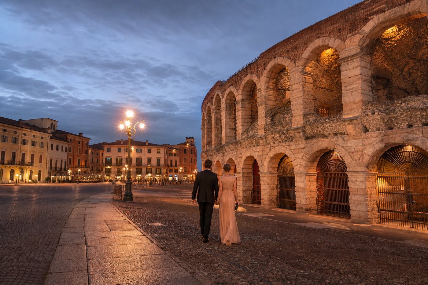 Elegant couple walking beside Verona Arena at evening