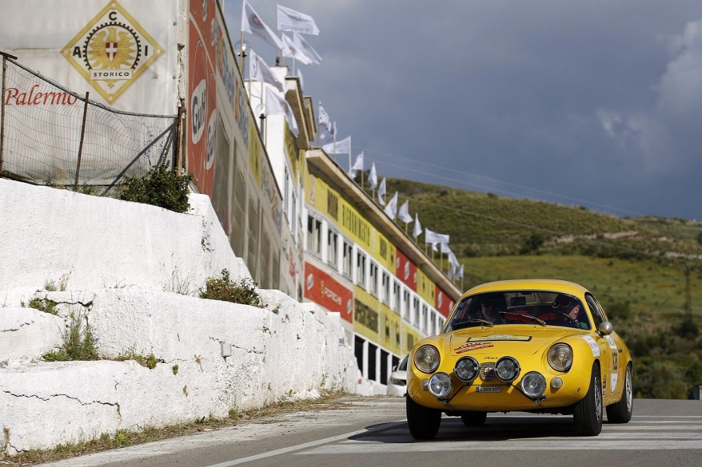 Historic yellow Porsche at Floriopoli during Targa Florio in Sicily