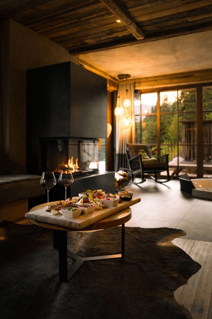 Chalet living room · fireplace and aperitivo at sunset