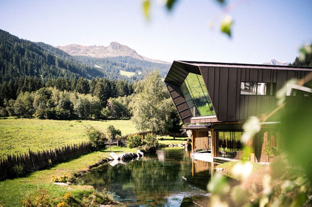 Contemporary wing by the pond with alpine meadow