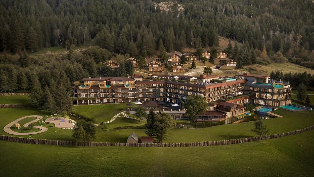 Alpura Retreat · summer exterior with suites, chalets, pools and alpine forest in Racines