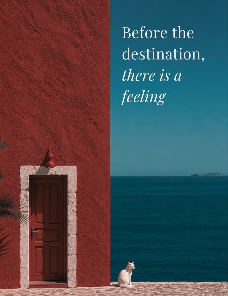 White cat beside red Mediterranean architecture overlooking a deep blue sea, with the words Before the destination, there is a feeling
