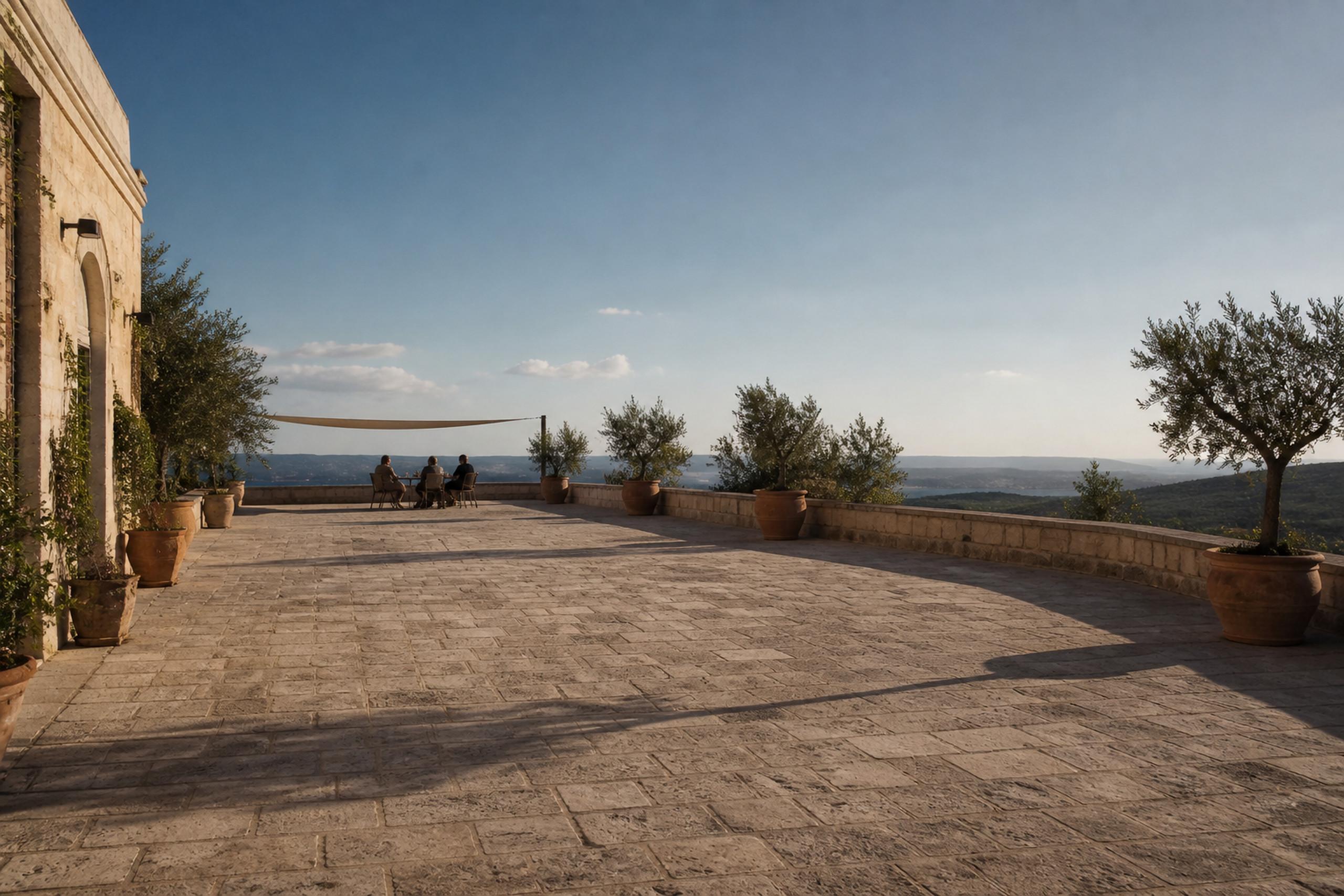 Spacious Mediterranean hotel terrace overlooking the Italian landscape