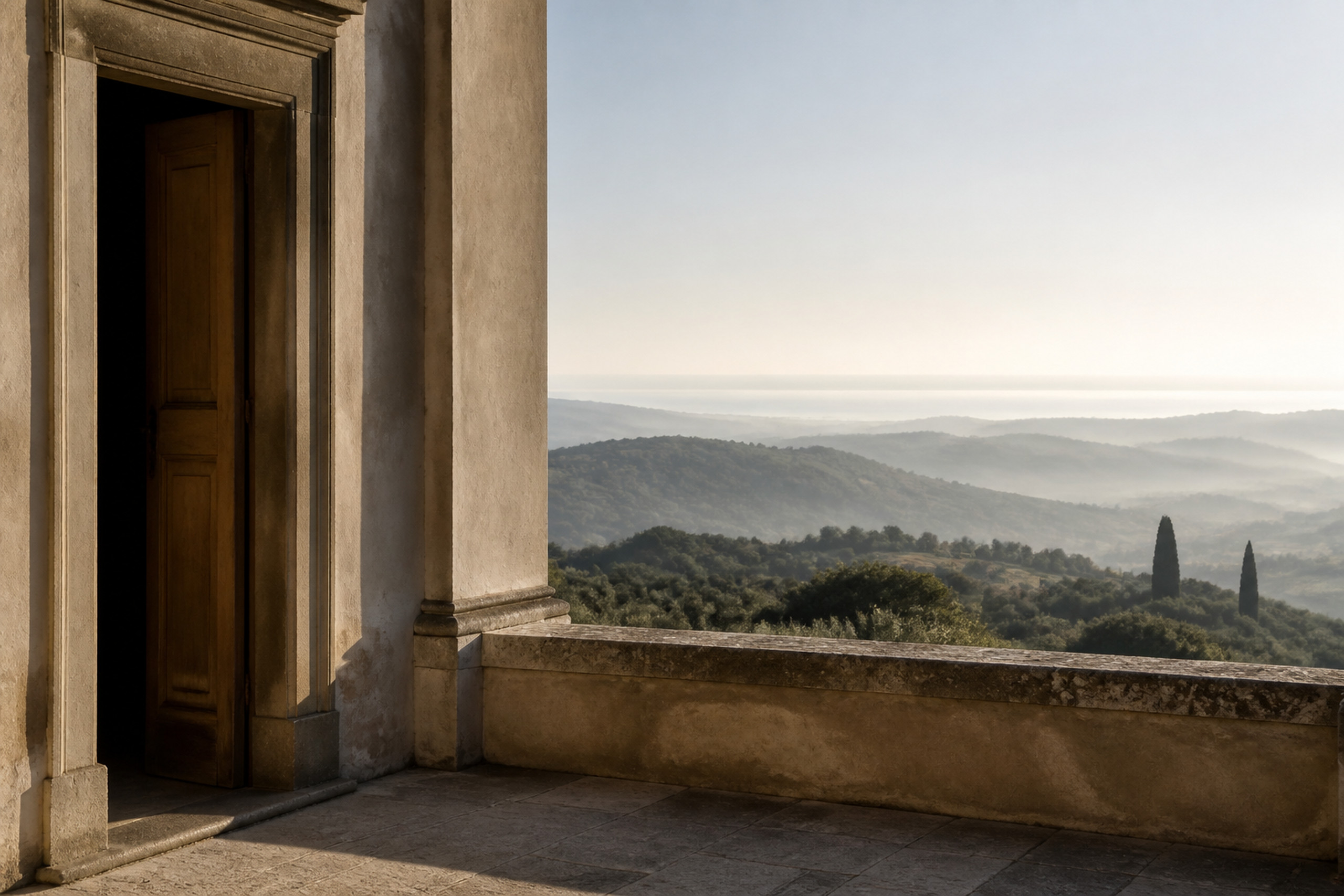 Italian architectural loggia opening onto a layered landscape at early morning