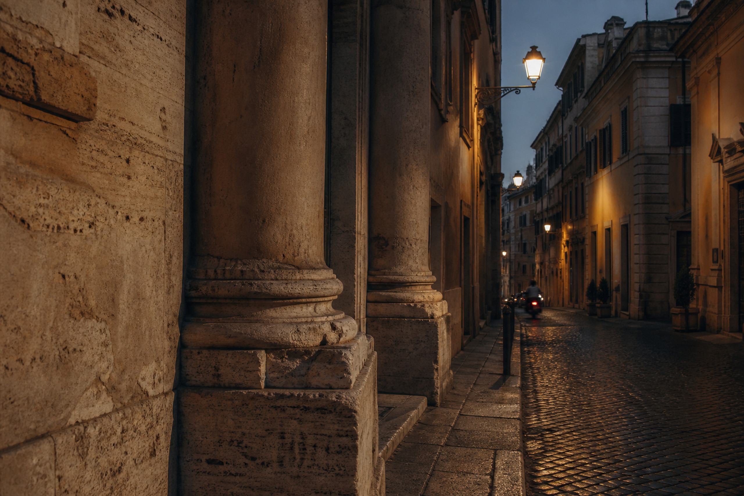 Travertine street in Rome at evening with a passing scooter