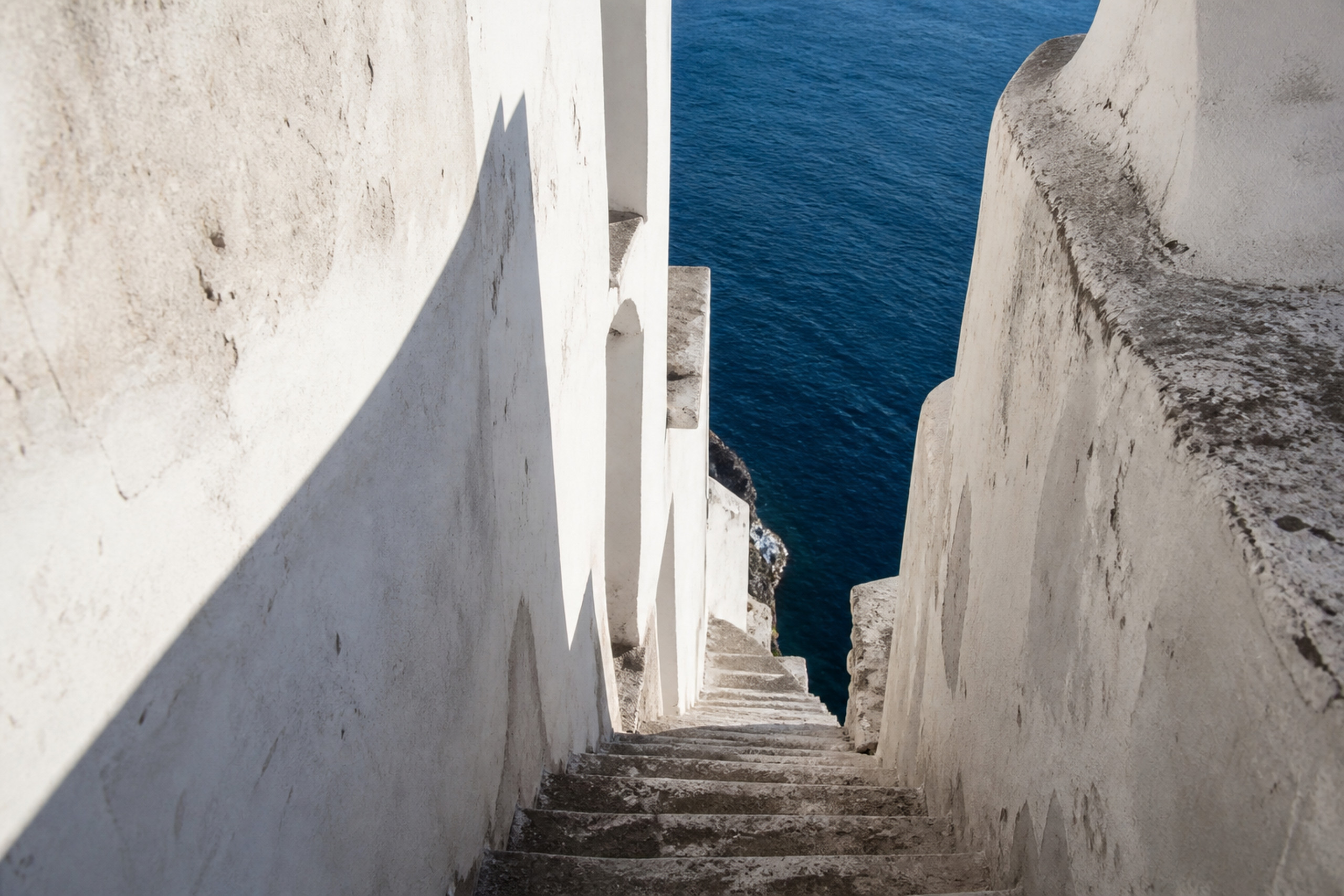 Stone passage and stairway opening toward the Mediterranean on the Amalfi Coast