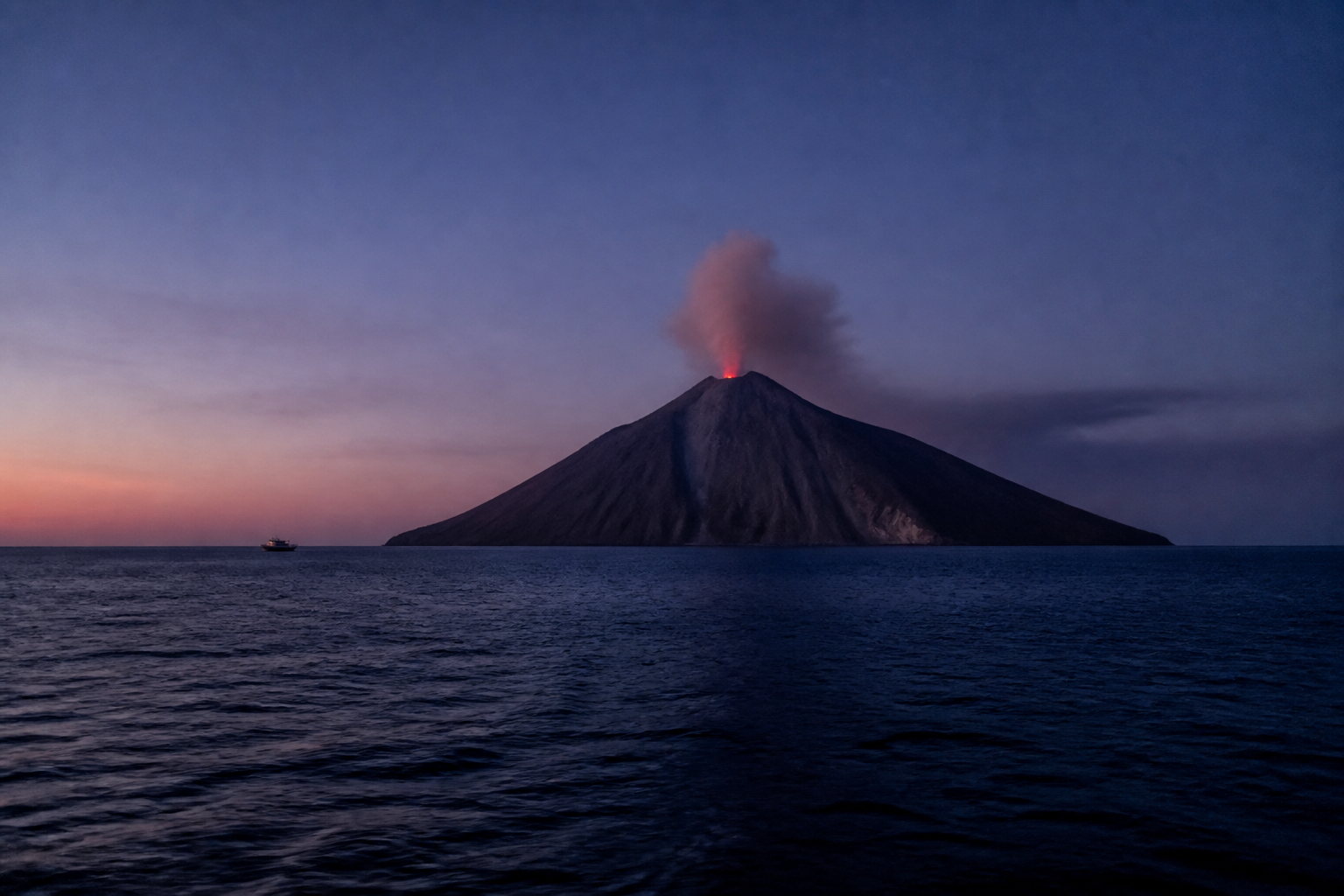 Aeolian Islands and volcanic coastline from the Sicilian sea