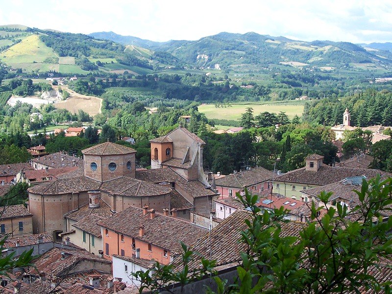 Brisighella roofs and the gypsum hills of Romagna beyond.