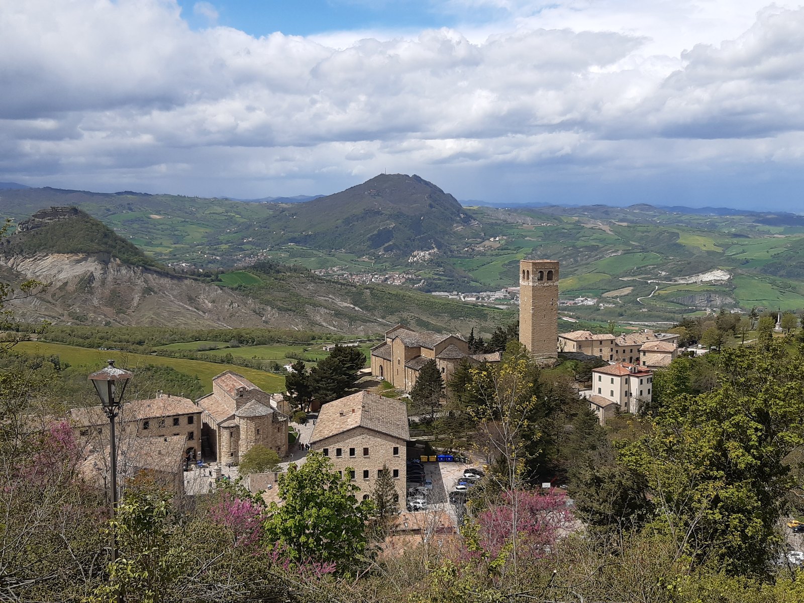 San Leo from above: the Romanesque piazza, the campanile, the fortress on its rock across the Marecchia.