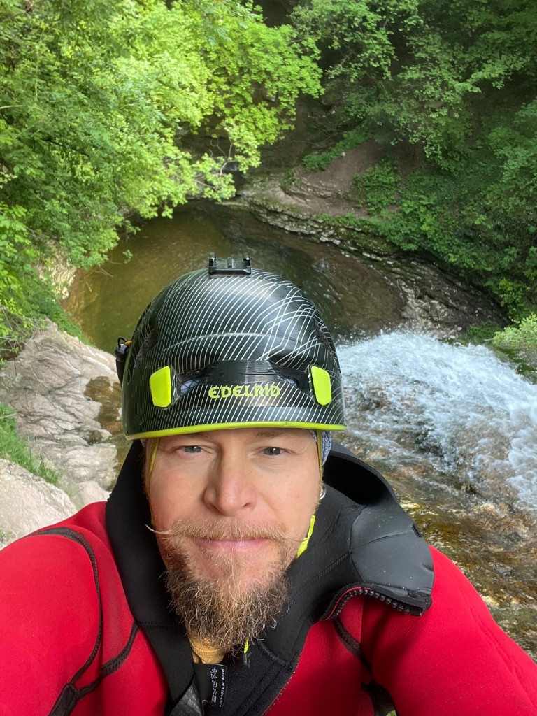 Christian Cavallin in canyoning gear above a waterfall — OHH! ITALY Journal